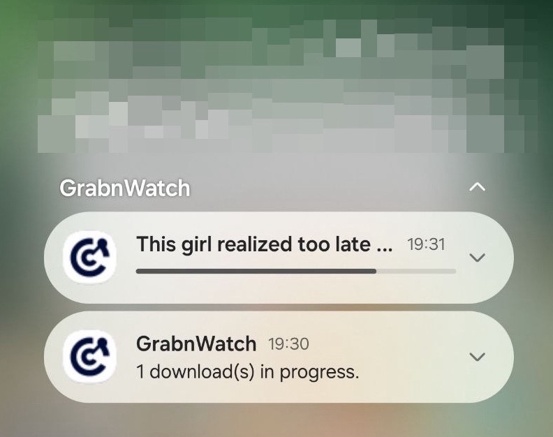 Android notifications showing a GrabnWatch download in progress