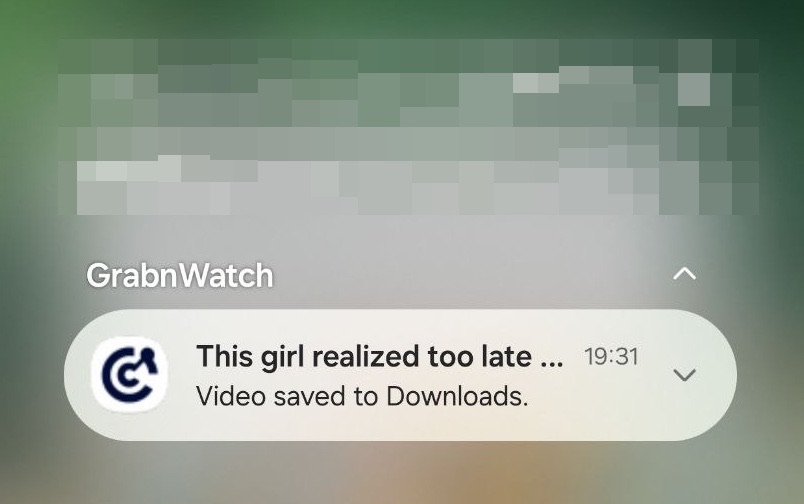 GrabnWatch notification saying the video was saved to Downloads